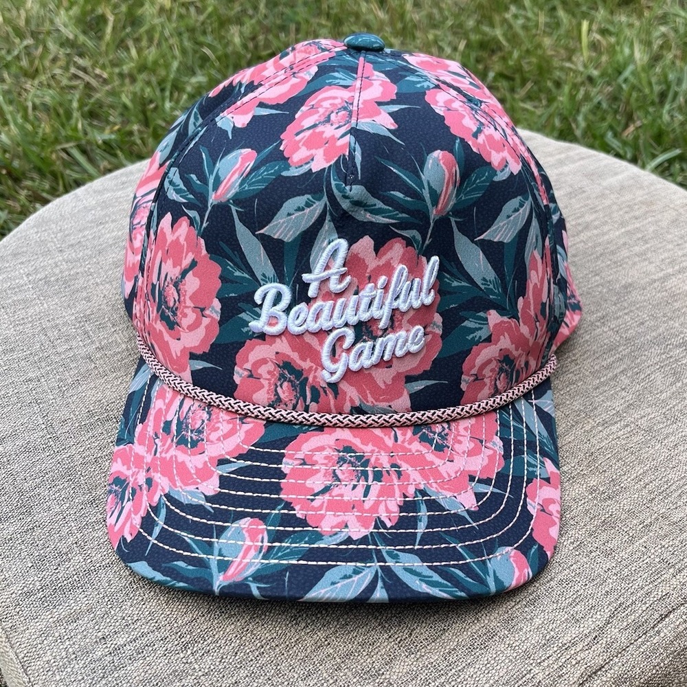 PUMA Golf Hat A Beautiful Game Floral Dark Myrtle -Pink Fruit EUC 110 Flex Fit